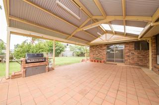 Large paved outdoor area with built BBQ