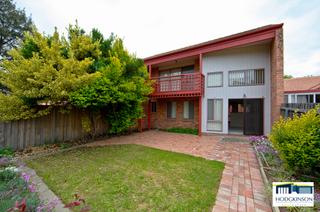 Rear view, with upstairs deck to left of photo