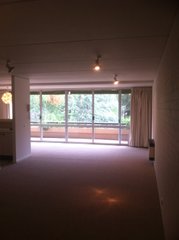 Front door to living area and balcony