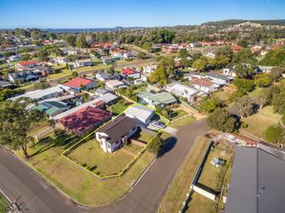 aerial shot of the block and the lake in the background