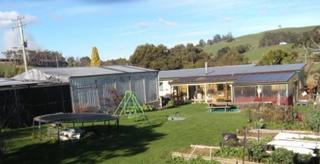 backyard view of house and shed