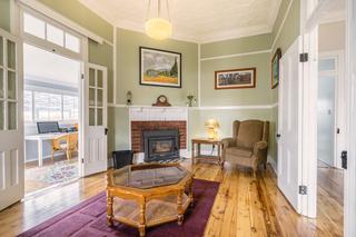 Cosy formal lounge room with wood heater