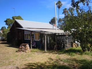 House to rear of block