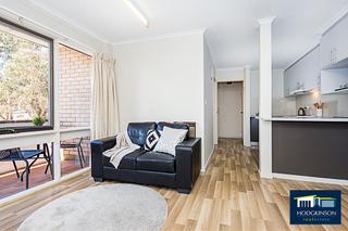 Living area to kitchen and bedroom