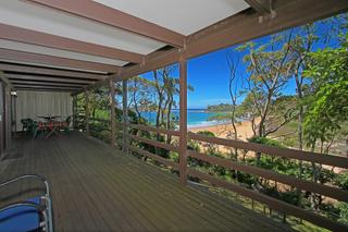 Spacious deck overlooking beach and ocean