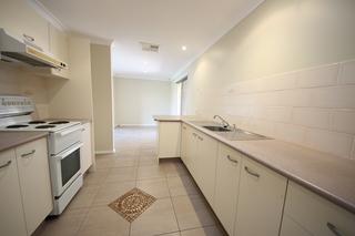 Galley Kitchen with skylight opens to dining room