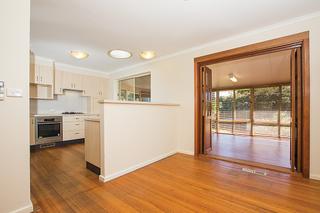 Dining to Kitchen and Sunroom