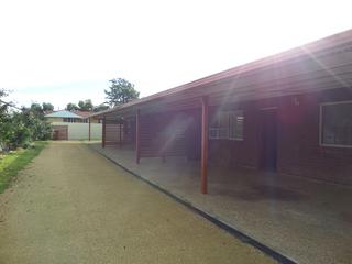 Easy to maintain gravel drive with each unit having a carport an